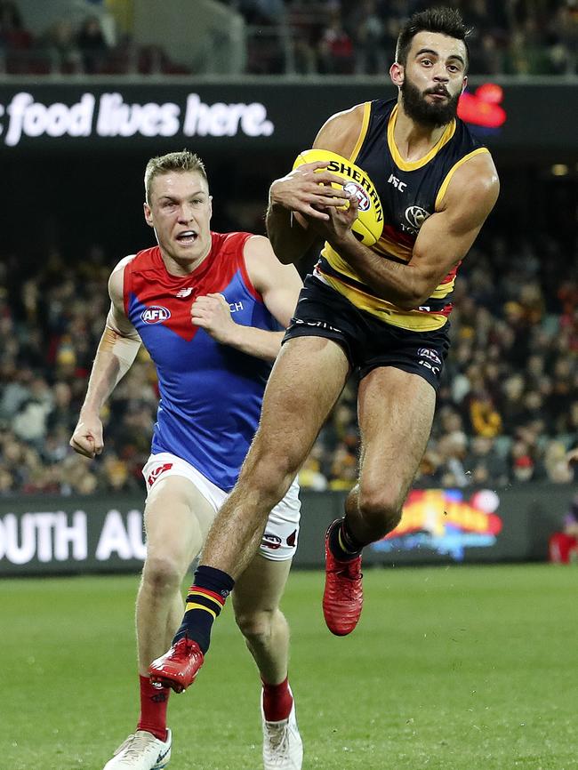 Crow Wayne Milera marks in front of Tom McDonald on Saturday night. Picture: Sarah Reed