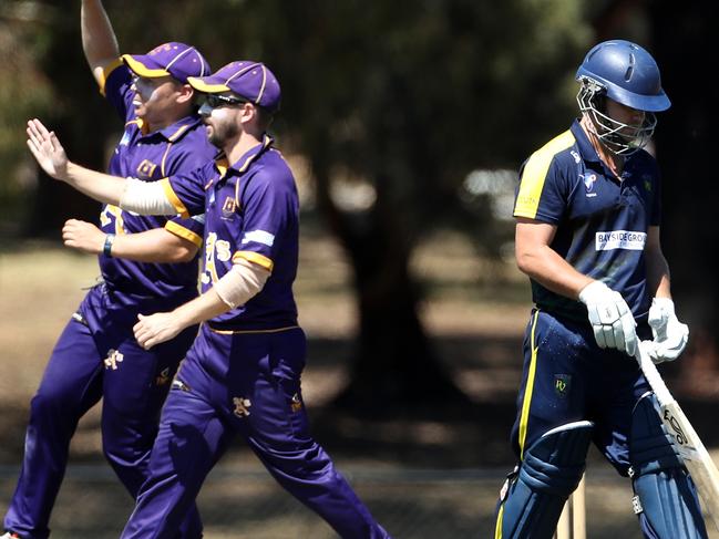 Ryan Pearson of Plenty Valley walks as Altona celebrate his dismissal during the VSDCA match between Plenty Valley and Altona played at Watsonia on Saturday 3rd March, 2018.