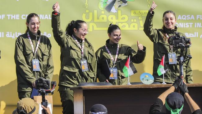 Israeli soldier hostages Naama Levy, Daniella Gilboa, Karina Ariev and Liri Albag, salute a Palestinian crowd before being handed over to the Red Cross in Gaza City on January 25, 2025. Picture: AP