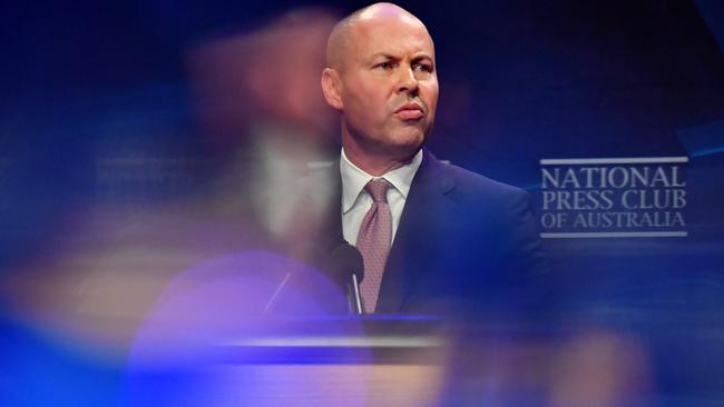 CANBERRA, AUSTRALIA - MAY 12: Federal Treasurer Josh Frydenberg holds a copy of the 2021-2022 Federal Budget before he delivers his budget address at National Press Club, in the Great Hall at Parliament House on May 12, 2021 in Canberra, Australia. The Morrison government's third budget, handed down on Tuesday, has an increased focus on women, with almost $354 million in funding allocated for women's health. Treasurer Josh Frydenberg also outlined more than $10 billion in spending on major infrastructure projects across Australia aimed to help create local jobs and boost productivity in the COVID-affected national economy. Aged care will receive more than $10 billion over the next four years, in direct response to the findings of the Royal Commission into Aged Care Quality and Safety. (Photo by Sam Mooy/Getty Images)