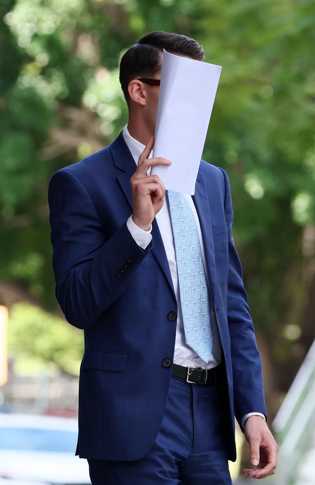 Tyler Phillip Sullivan hides from media at the Brisbane Supreme Court. Picture: NewsWire/Tertius Pickard