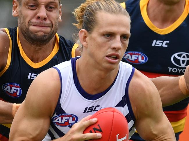 Nat Fyfe of the Dockers and Cam Ellis-Yolmen of the Crows during the community series match between the Adelaide Crows and the Fremantle Dockers at Strathalbyn Oval, Strathalbyn in Adelaide, Sunday, February 25, 2018. (AAP Image/David Mariuz) NO ARCHIVING, EDITORIAL USE ONLY