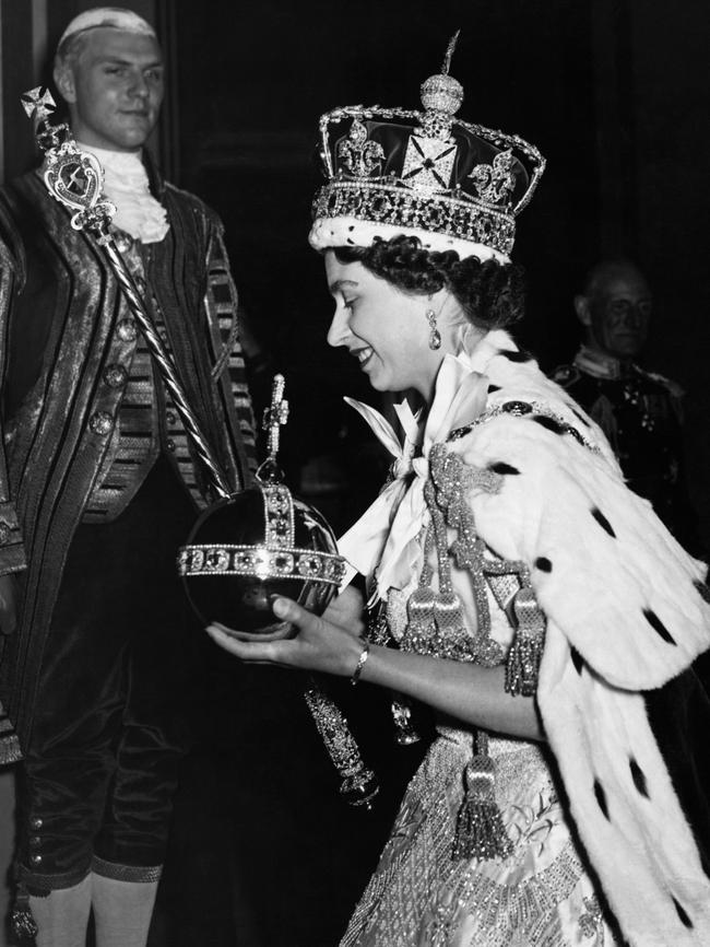 Queen Elizabeth II arrives at Buckingham Palace from Westminster Abbey, after her coronation in 1953. Picture: Getty images