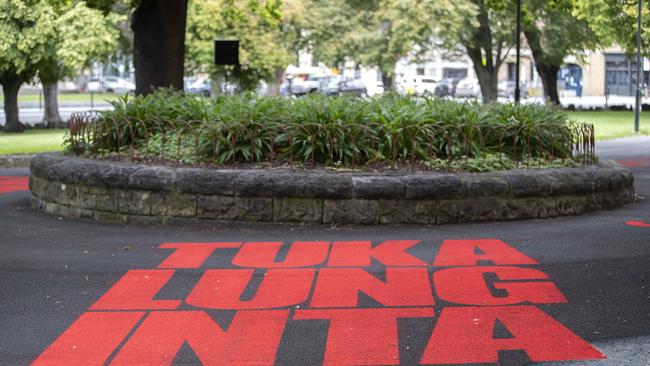 Artists Kartanya Maynard and Vernon Ah Kee activate the space outside parliament with language and sound, palawa kani and calls of protest. . Picture: Chris Kidd