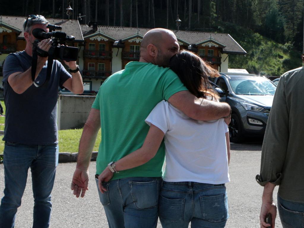 A relative of a missing person is comforted at the scene. Picture: Pierre Teyssot/AFP