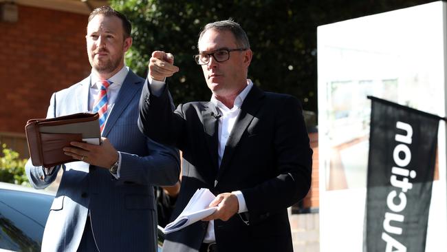 John McGrath in action as auctioneer at a Saturday auction where the house sold for $1.825m. Picture: David Swift.