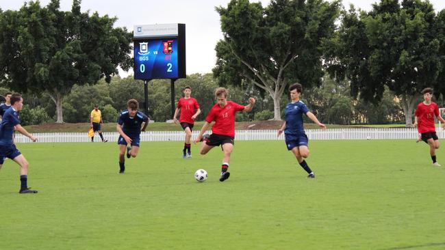 Gregory Terrace’s Will Dent taking a shot at goal.