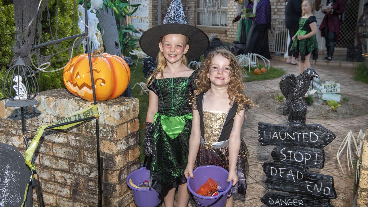 Ivy and Layla Read visit the Halloween display of Jo Philp. Monday, October 31, 2022. Picture: Nev Madsen.