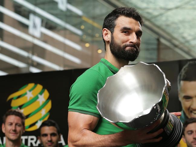 SYDNEY, AUSTRALIA - FEBRUARY 01: Socceroos captain Mile Jedinak holds aloft the Asian Cup during celebrations at Westfield Sydney on February 1, 2015, after the Socceroos won the 2015 Asian Cup last night, in Sydney, Australia. (Photo by Mark Metcalfe/Getty Images)