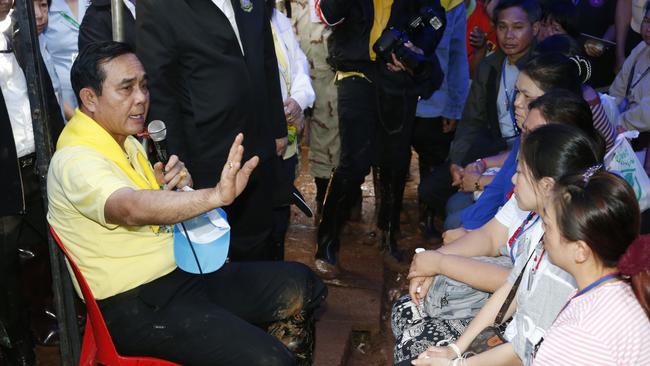 Thailand's Prime Minister Prayuth Chan-ocha, pictured last month with family of the 12 boys, is expected to visit the cave site. Picture: AP