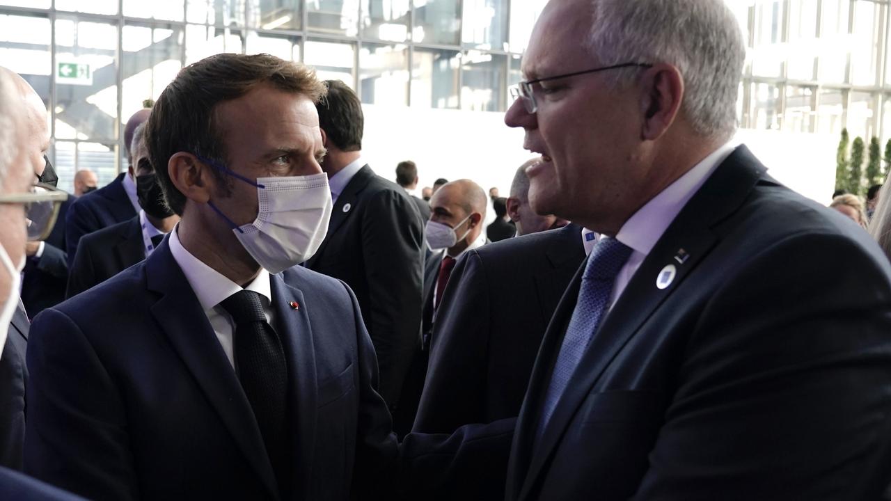 Australian Prime Minister Scott Morrison interrupts French President Emmanuel Macron in Rome on Saturday. Picture: Adam Taylor.