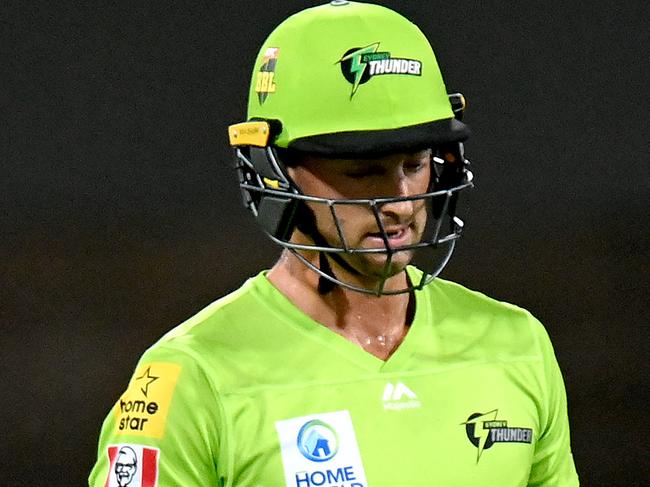 BRISBANE, AUSTRALIA - JANUARY 04: Daniel Sams of the Thunder looks dejected after losing his wicket during the Big Bash League match between the Brisbane Heat and the Sydney Thunder at The Gabba, on January 04, 2021, in Brisbane, Australia. (Photo by Bradley Kanaris/Getty Images)