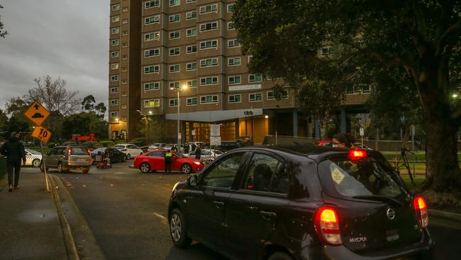 Cars approach housing commission units in the Melbourne suburb of Flemington. Picture: Getty Images