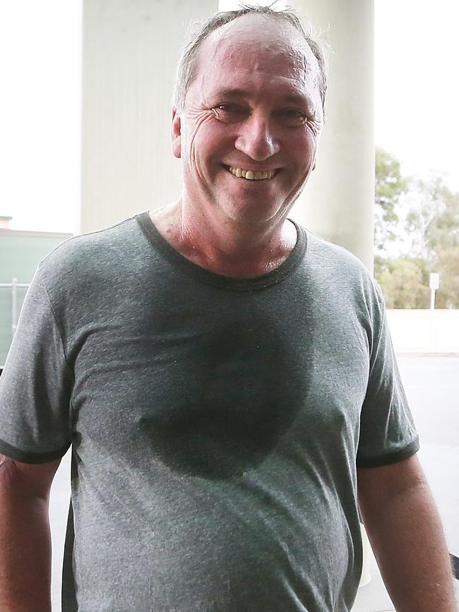 Hot and bothered: Barnaby Joyce enters Parliament House after a run. Picture: Kym Smith