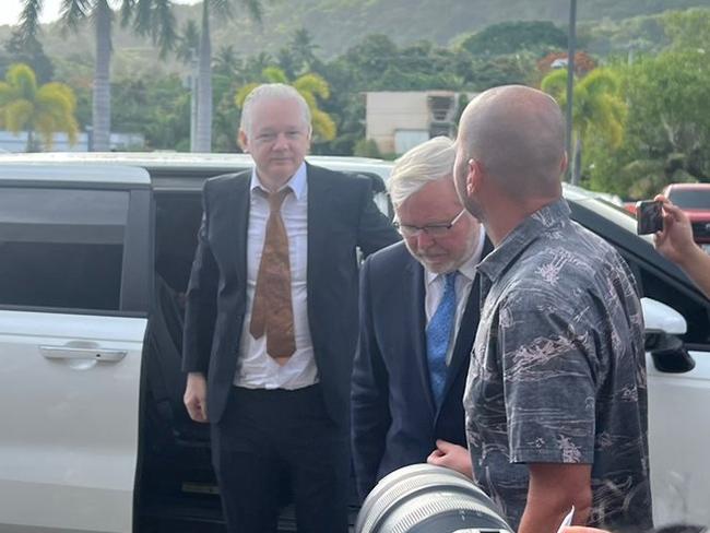 Julian Assange arrives at court in Saipan with Kevin Rudd. Picture: News Corp