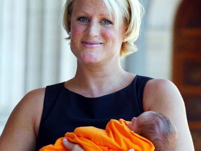 Marshall with baby daughter Charlotte Louise outside Parliament House in Melbourne 24 Feb 2003.