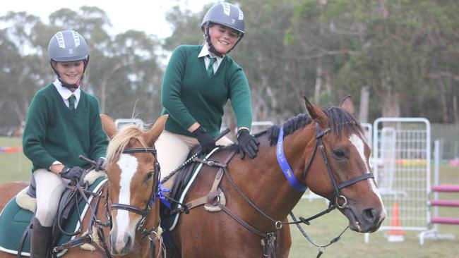 Emma and Jessica Galea at a zone showjumping event at the Hills District Pony Club. 