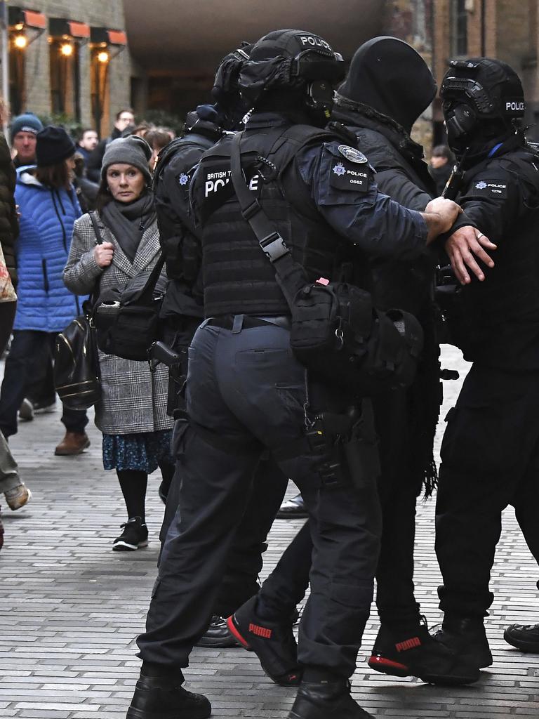 Police apprehend a man in a street on the south side of London Bridge. Picture: /Alberto Pezzali.