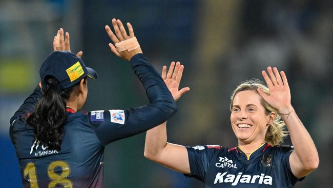 Royal Challengers Bangalore's Sophie Molineux celebrates with captain Smriti Mandhana after taking the wicket of Delhi Capitals' Shafali Verma during the Women's Premier League Twenty20 cricket final match between Royal Challengers Bangalore and Delhi Capitals at the Arun Jaitley Stadium in New Delhi on Sunday. Picture: Sajjad Hussain/AFP