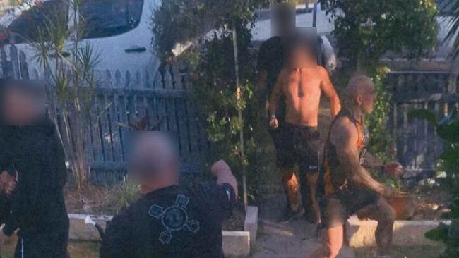 The first picture tendered showed the men arriving at Mr Hawkins’s home. The man in the black shirt with his back to the camera is a witness to the alleged incident and not one of the accused.