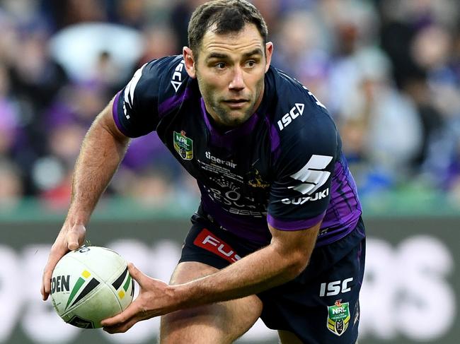 Cameron Smith of the Storm passes the ball during the NRL qualifying final between the Melbourne Storm and the Parramatta Eels at AAMI park in Melbourne, Saturday, September 9, 2017. (AAP Image/Joe Castro) NO ARCHIVING, EDITORIAL USE ONLY