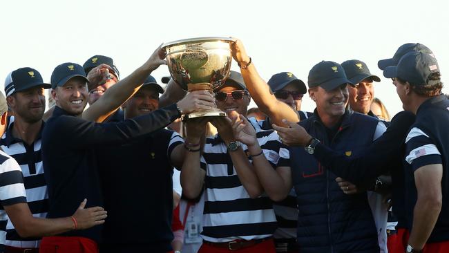 Dustin Johnson and team USA host the trophy after their Presidents Cup win in 2017. Picture: Sam Greenwood/Getty Images.