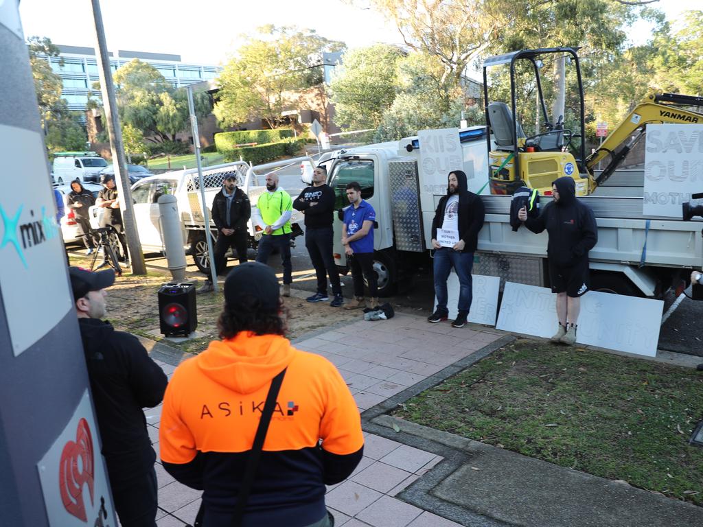 Protesters outside the KIIS FM studio at North Ryde . Protesters are holding a peaceful stand outside the studios while Kyle and Jackie o are on holidays .picture John Grainger