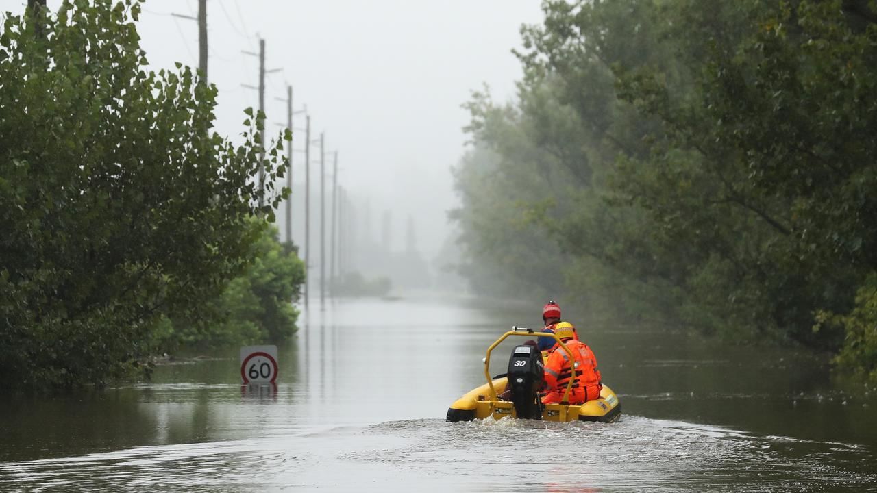 State Emergency Service workers drive their rescue craft through the flooded Hawkesbury river along Inalls Lane in Richmond. Picture: Getty Images