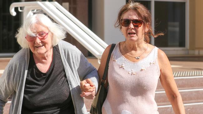 Kylie Wilkins leaves court with her mother, Judith Wilkins, after giving evidence in day one of Ben Hoffmann’s murder trial. Picture: Glenn Campbell