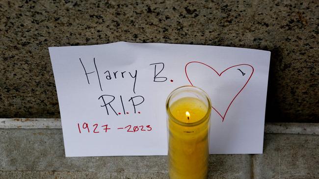 A candle sits outside the apartment building believed to be the home of activist and entertainer Harry Belafonte, in New York. Picture: AFP.