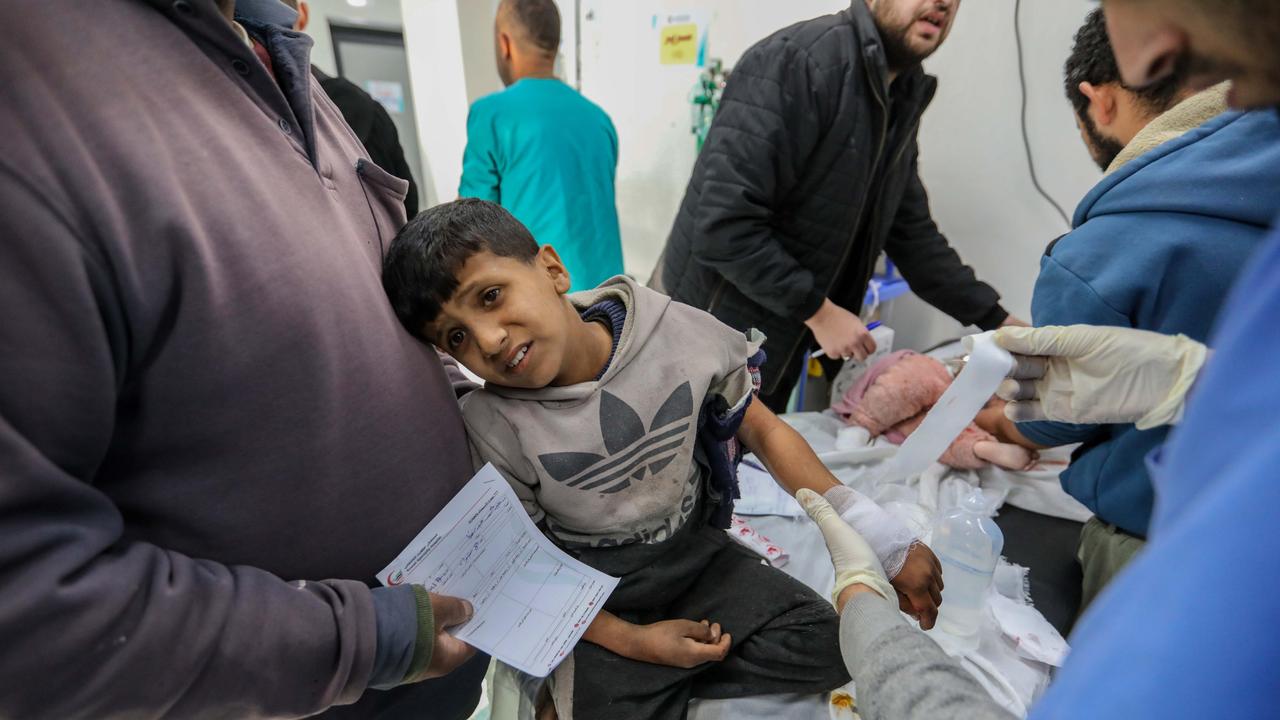 A boy is being treated for injuries from an Israeli airstrike. Picture: Ahmad Hasaballah