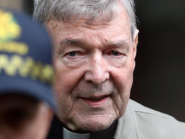 (FILES) This file photo taken on February 26, 2019 shows Cardinal George Pell (R) leaving the County Court of Victoria court in Melbourne. - Australian Cardinal George Pell will return to Rome on September 29, 2020 for the first time since being acquitted of child sexual abuse charges, and just days after a Vatican rival was ousted. (Photo by Con CHRONIS / AFP)