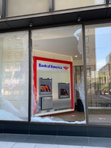 A smashed window of a Bank of America branch in Washington. Picture: Cameron Stewart