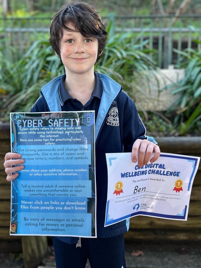 Benjamin Smith with some school awards.