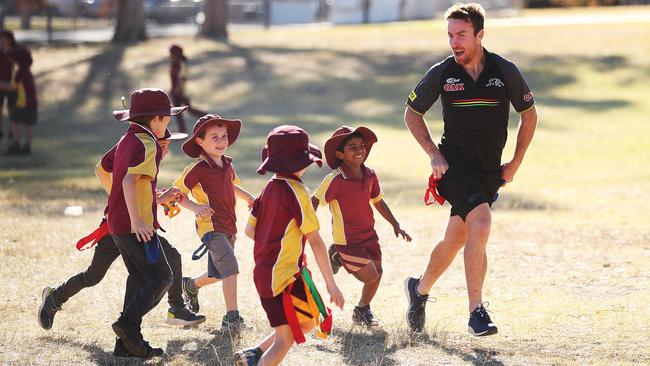 Maloney gets the kids moving during a visit to Penrith South Public School. (Phil Hillyard)