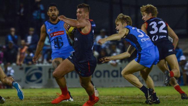 Norwood's Mitchell Grigg attempts to evade Sturt’s Steven Slimming. Picture: Brenton Edwards/AAP