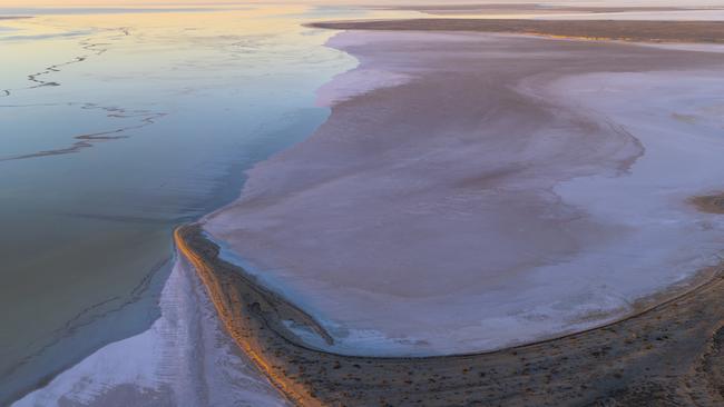 Hambridge Point is engulfed by the floodwaters advancing across the lake bed. Picture: Tom Putt / Wrightsair