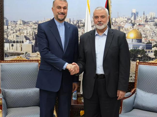 Iran’s Foreign Minister Hossein Amir Abdollahian (left) greets Hamas' political bureau chief Ismail Haniyeh in Doha. Picture: AFP