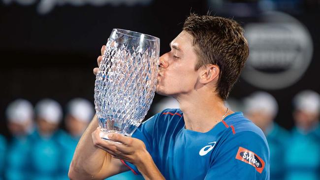 Alex de Minaur lifts the trophy at The Sydney International in January. Picture: Speed Media/Icon Sportswire via Getty Images