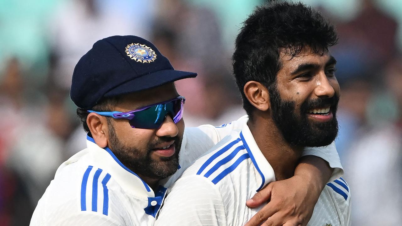 India's Jasprit Bumrah and captain Rohit Sharma. Photo by DIBYANGSHU SARKAR / AFP