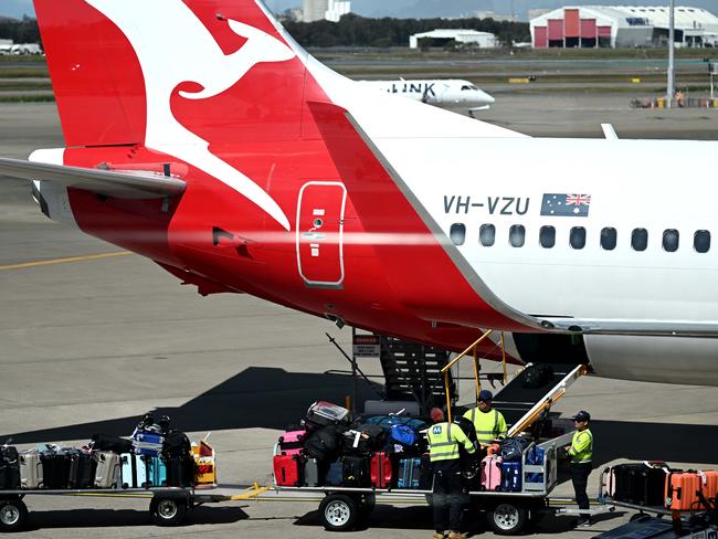 BRISBANE, AUSTRALIA - NewsWire Photos - AUGUST 11, 2022. Qantas baggage handlers at work at Brisbane airport. Industrial action will start at Qantas and budget offshoot Jetstar by the end of August amid an escalating fight over pay with its licensed engineers.Picture: NCA NewsWire / Dan Peled