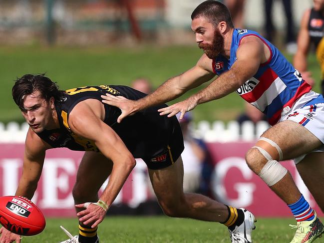 Central’s Isaya McKenzie pressures Glenelg’s Max Proud during a SANFL match in 2018. Picture: Tait Schmaal