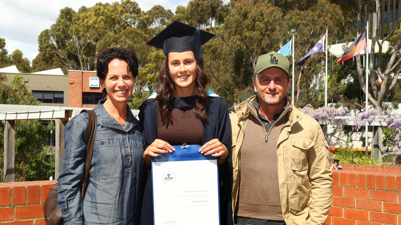 Deakin University graduate Yasmin North-Stone with parents Melanie and Matt. Picture: Alison Wynd