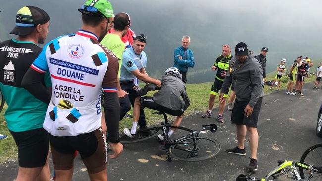 Chris Froome is tackled by a policeman. Picture: Instagram