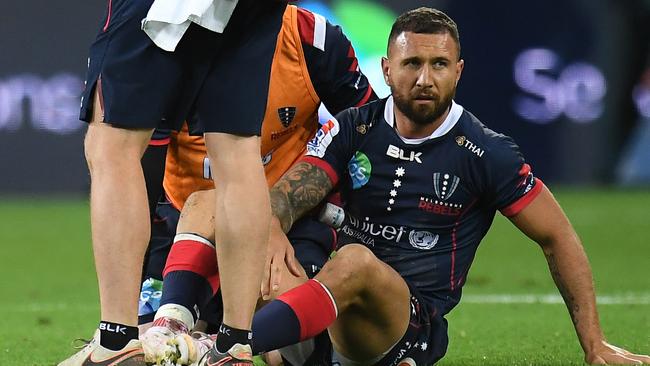 Rebels five-eighth Quade Cooper was concussed trying to tackle Reds captain Samu Kerevi on Friday night. Picture: AAP