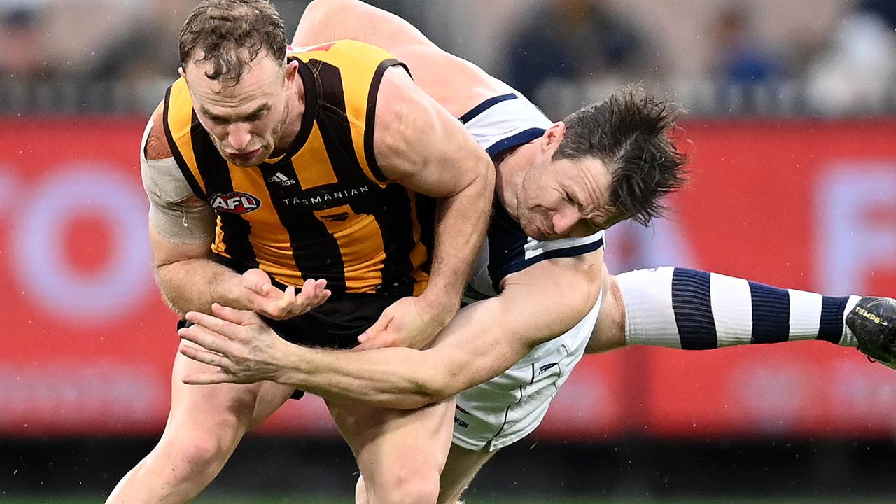 Tom Mitchell bumps Patrick Dangerfield during Easter Monday’s epic contest. Picture: Getty Images