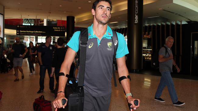 Injured cricketer Mitchell Starc arrives at Sydney Airport (Jane Dempster/Daily Telegraph)