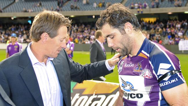 Melbourne Storm NRL team captain Cameron Smith (R) talking with coach Craig Bellamy after they defeated the New Zealand Warriors at AAMI Park in Melbourne, 25/04/2010 in their first match since been found guilty of breaching the salary cap in a fraud which has rocked Australian sport.