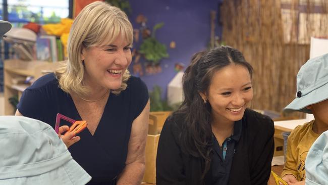 Education Minister Eva Lawler and Gray Childcare Centre educator and group leader Tiffany Tran celebrate Early Learning Matters Week with Territory kids. Picture: Sierra Haigh