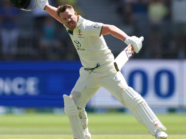 PERTH, AUSTRALIA - DECEMBER 14: David Warner of Australia celebrates after scoring a century during day one of the Men's First Test match between Australia and Pakistan at Optus Stadium on December 14, 2023 in Perth, Australia. (Photo by Paul Kane/Getty Images)